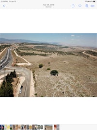 an aerial view of a road and a desert