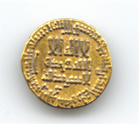 a gold coin with arabic writing on it